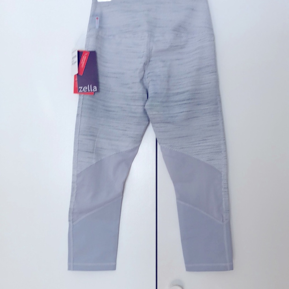 Zella yoga pants, new with tags, gray and white thin stripes, size S.